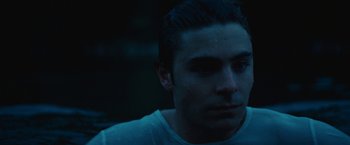 Movie still from “Charlie St. Cloud” (2010), directed by Burr Steers – A person wearing a white t - shirt; Close Up shot, Over the shoulder angle