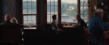 Movie still from “Charlie St. Cloud” (2010), directed by Burr Steers – Two people sitting at a table in front of a window; Wide shot, Over the shoulder angle