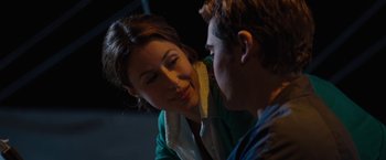 Movie still from “Charlie St. Cloud” (2010), directed by Burr Steers – A woman is smiling at a young man; Close Up shot, Over the shoulder angle