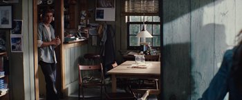 Movie still from “Charlie St. Cloud” (2010), directed by Burr Steers – A table and chairs in a room with a window; Wide shot, High angle