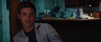 Movie still from “Charlie St. Cloud” (2010), directed by Burr Steers – A man sitting in front of a kitchen counter; Close Up shot, Over the shoulder angle