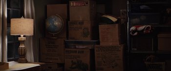 Movie still from “Charlie St. Cloud” (2010), directed by Burr Steers – Boxes stacked on top of each other in a room; Close Up shot, High angle
