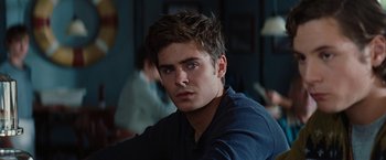 Movie still from “Charlie St. Cloud” (2010), directed by Burr Steers – A man sitting in front of a wall with his eyes closed; Close Up shot, Over the shoulder angle