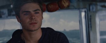Movie still from “Charlie St. Cloud” (2010), directed by Burr Steers – A person wearing a black shirt; Close Up shot, Over the shoulder angle