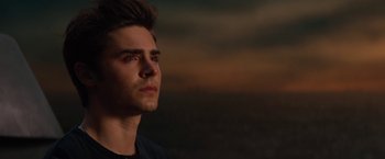 Movie still from “Charlie St. Cloud” (2010), directed by Burr Steers – A young man is looking into the distance; Close Up shot, Over the shoulder angle