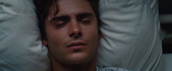 Movie still from “Charlie St. Cloud” (2010), directed by Burr Steers – A person laying in a bed; Close Up shot, Overhead angle