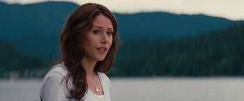 Movie still from “Charlie St. Cloud” (2010), directed by Burr Steers – A beautiful young lady standing next to a body of water; Close Up shot, Over the shoulder angle