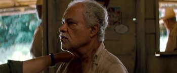 Movie still from “Che: Part One” (2008), directed by Steven Soderbergh – An older man with white hair is looking into the distance; Close Up shot, Low angle