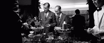 Movie still from “Che: Part One” (2008), directed by Steven Soderbergh – A black and white photo of two men standing next to each other; Medium shot, Low angle