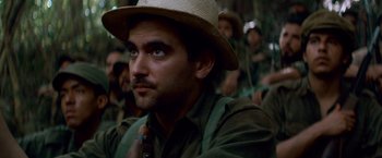 Movie still from “Che: Part One” (2008), directed by Steven Soderbergh – A person wearing a hat; Close Up shot, Low angle