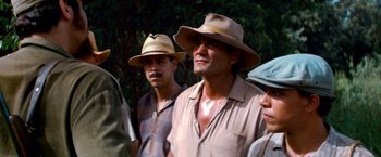 Movie still from “Che: Part One” (2008), directed by Steven Soderbergh – A group of men standing next to each other wearing hats; Close Up shot, Low angle