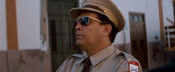 Movie still from “Che: Part One” (2008), directed by Steven Soderbergh – A man in a hat and sunglasses is looking to the side; Close Up shot, Low angle