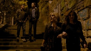 Movie still from “Chernobyl Diaries” (2012), directed by Bradley Parker – A group of people standing on some steps; Wide shot, Low angle