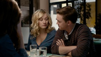 Movie still from “Chernobyl Diaries” (2012), directed by Bradley Parker – A man and a woman sitting at a table; Medium shot, Over the shoulder angle