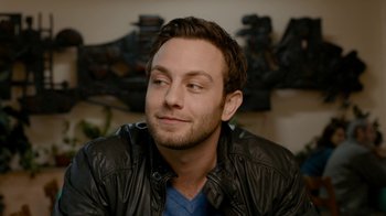 Movie still from “Chernobyl Diaries” (2012), directed by Bradley Parker – A person wearing a leather jacket; Close Up shot, Over the shoulder angle