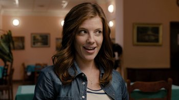 Movie still from “Chernobyl Diaries” (2012), directed by Bradley Parker – A beautiful young woman with long brown wavy hair; Close Up shot, Over the shoulder angle