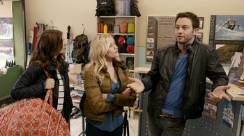 Movie still from “Chernobyl Diaries” (2012), directed by Bradley Parker – Two women and a man are talking in a room; Medium shot, Over the shoulder angle