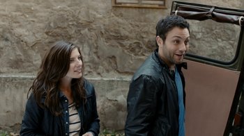 Movie still from “Chernobyl Diaries” (2012), directed by Bradley Parker – A man and a woman standing next to each other; Medium shot, Over the shoulder angle