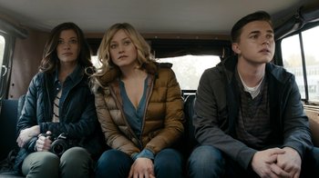 Movie still from “Chernobyl Diaries” (2012), directed by Bradley Parker – A group of people sitting in the back of a vehicle; Medium shot, High angle