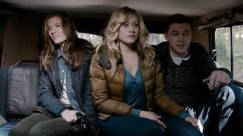 Movie still from “Chernobyl Diaries” (2012), directed by Bradley Parker – A group of people sitting in the back of a car; Medium shot, High angle