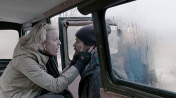 Movie still from “Chernobyl Diaries” (2012), directed by Bradley Parker – A woman talking to a man on a bus; Close Up shot, Over the shoulder angle