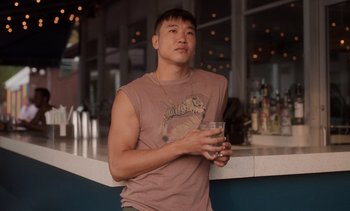 Movie still from “Fire Island” (2022), directed by Andrew Ahn – Medium shot, Low angle