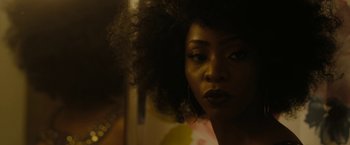 Movie still from “Chi-Raq” (2015), directed by Spike Lee – A person with a curly hair; Close Up shot, Over the shoulder angle