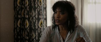 Movie still from “Chi-Raq” (2015), directed by Spike Lee – A person wearing a white shirt; Close Up shot, Over the shoulder angle