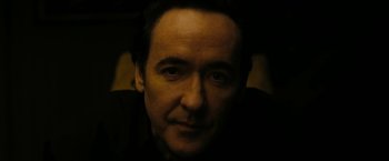 Movie still from “Chi-Raq” (2015), directed by Spike Lee – A person wearing a black shirt; Close Up shot, Low angle