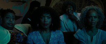 Movie still from “Chi-Raq” (2015), directed by Spike Lee – A woman in a blue dress and a woman in a black dress; Close Up shot, Over the shoulder angle