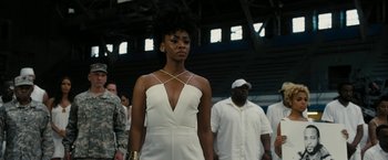 Movie still from “Chi-Raq” (2015), directed by Spike Lee – A woman in a white dress; Medium shot, Low angle