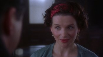 Movie still from “Chocolat” (2000), directed by Lasse Hallström – A person wearing a headband; Close Up shot, Over the shoulder angle