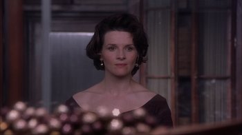Movie still from “Chocolat” (2000), directed by Lasse Hallström – A person wearing a dress; Close Up shot, Over the shoulder angle