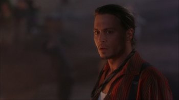 Movie still from “Chocolat” (2000), directed by Lasse Hallström – A person with long hair; Close Up shot, Over the shoulder angle