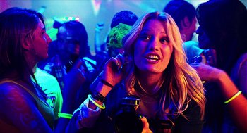 Movie still from “Chronicle” (2012), directed by Josh Trank – A woman is talking on a cell phone at a party; Close Up shot, Over the shoulder angle