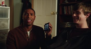 Movie still from “Chronicle” (2012), directed by Josh Trank – A man holding a cell phone in his hand; Close Up shot, Over the shoulder angle