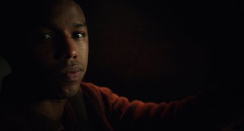Movie still from “Chronicle” (2012), directed by Josh Trank – A man's face in the dark; Close Up shot, Over the shoulder angle