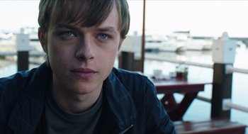 Movie still from “Chronicle” (2012), directed by Josh Trank – A person sitting at a table; Close Up shot, Over the shoulder angle
