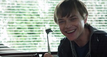 Movie still from “Chronicle” (2012), directed by Josh Trank – A young man holding a fork in front of a window; Close Up shot, Over the shoulder angle