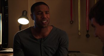 Movie still from “Chronicle” (2012), directed by Josh Trank – A man in a gray shirt is looking at the camera; Close Up shot, Over the shoulder angle