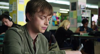 Movie still from “Chronicle” (2012), directed by Josh Trank – A man sitting in front of a laptop computer in a room; Close Up shot, Low angle