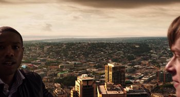Movie still from “Chronicle” (2012), directed by Josh Trank – An aerial view of a large city with buildings; Extreme Wide shot, Low angle