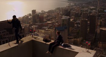 Movie still from “Chronicle” (2012), directed by Josh Trank – A man sitting on top of a building on top of a building; Extreme Wide shot, High angle