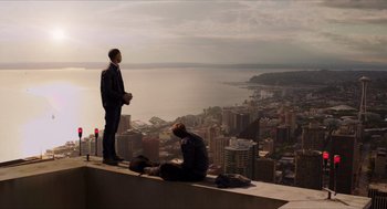 Movie still from “Chronicle” (2012), directed by Josh Trank – Two men are sitting on the edge of a building; Extreme Wide shot, High angle
