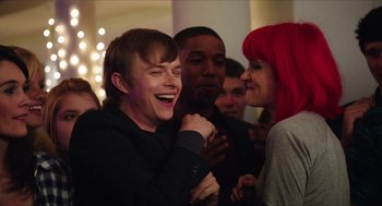 Movie still from “Chronicle” (2012), directed by Josh Trank – A group of people standing next to each other laughing; Medium shot, Over the shoulder angle