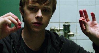 Movie still from “Chronicle” (2012), directed by Josh Trank – A young man is standing in front of a bathroom sink; Close Up shot, Over the shoulder angle
