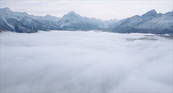 Movie still from “Chronicle” (2012), directed by Josh Trank – A view of a mountain range with a cloud filled sky; Extreme Wide shot, High angle