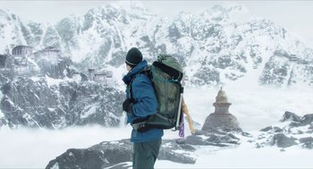 Movie still from “Chronicle” (2012), directed by Josh Trank – A man with a backpack walking in the snow; Wide shot, Low angle