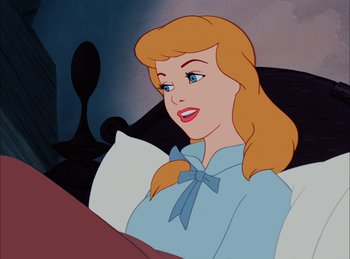 Movie still from “Cinderella” (1950), directed by Hamilton Luske – A woman with a blue bow tie sitting in a chair; Close Up shot, High angle