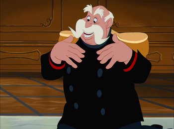 Movie still from “Cinderella” (1950), directed by Hamilton Luske – A man in a black jacket and a white beard; Medium shot, Over the shoulder angle